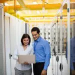 technicians discussing over laptop 2023 11 27 05 28 46 utc min