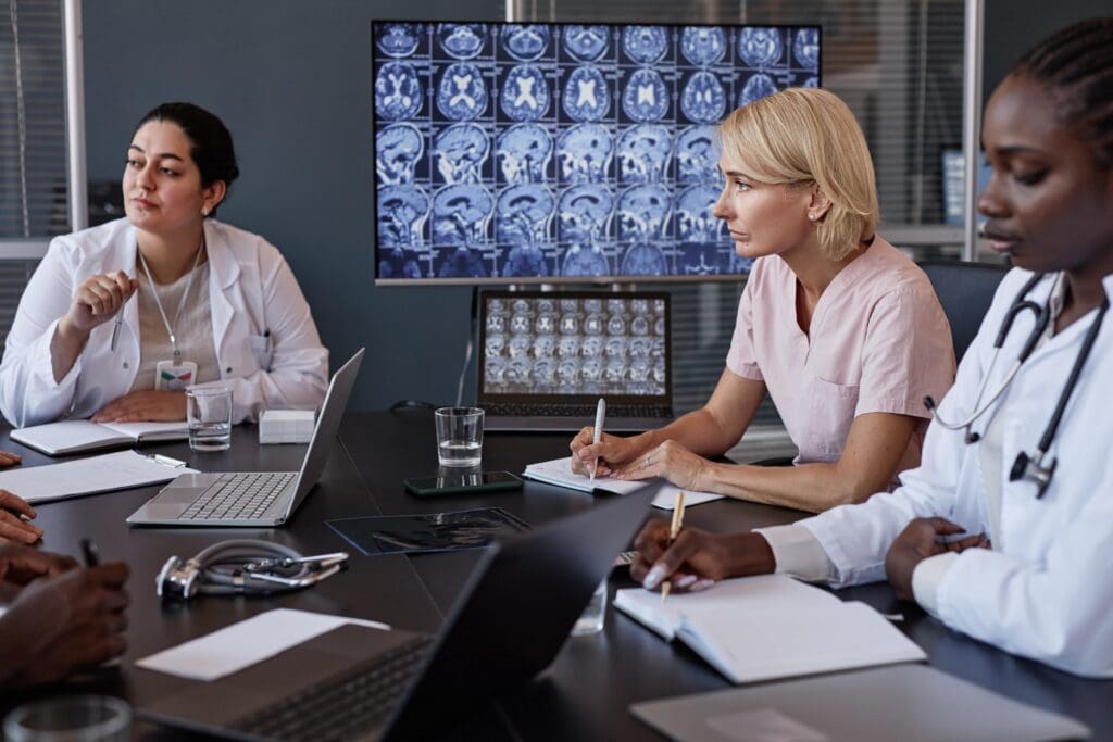 female neurologist writing notes while analyzing b 2024 12 26 23 49 51 utc min