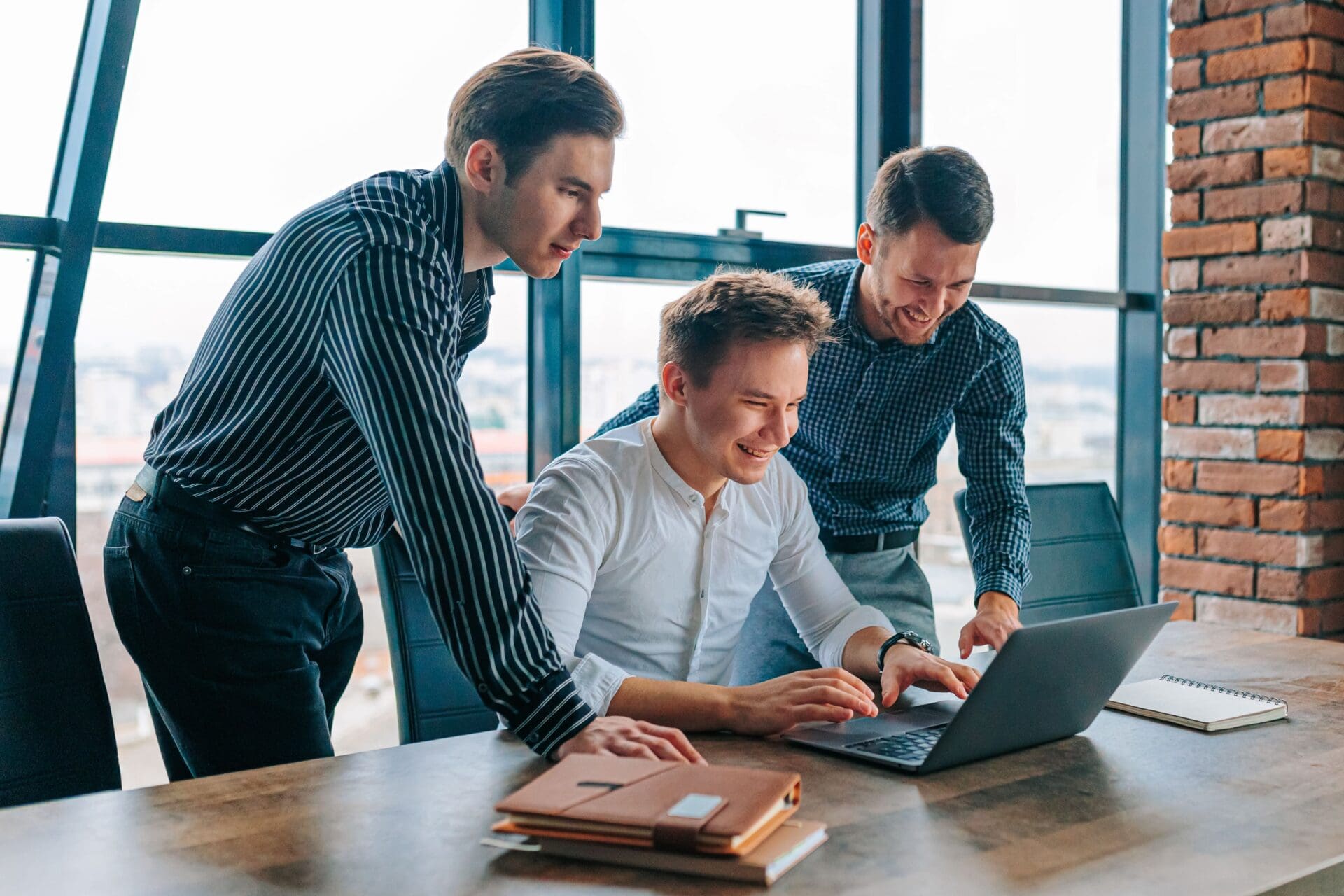 group of three male coworkers i celebrate success 2024 10 18 17 42 20 utc min